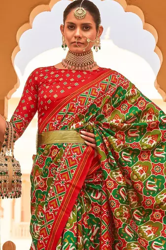 Green ethnic motifs printed zari ikat saree
