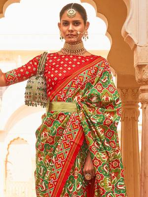 Green ethnic motifs printed zari ikat saree 3