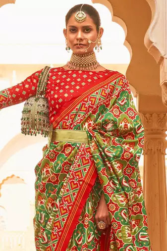 Green ethnic motifs printed zari ikat saree