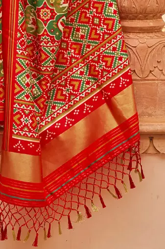 Green ethnic motifs printed zari ikat saree