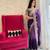 Purple purple & gold-tones floral embroidered saree