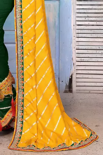 Yellow striped sequinned half and half saree