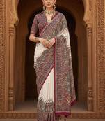 Off white ethnic motifs woven design banarasi saree with blouse piece