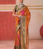 Orange ethnic motifs woven design zari pochampally saree