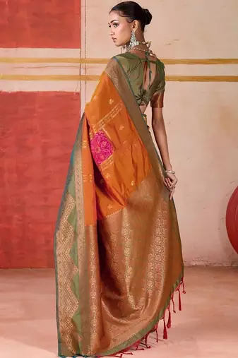 Orange ethnic motifs woven design zari pochampally saree
