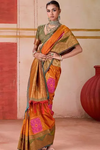 Orange ethnic motifs woven design zari pochampally saree