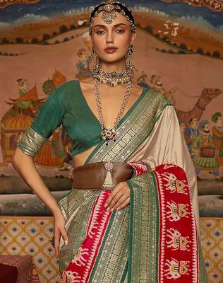 Beige ethnic motifs woven design patola saree 1