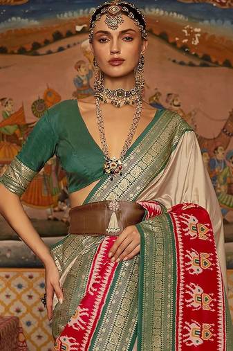 Beige ethnic motifs woven design patola saree