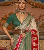 Beige ethnic motifs woven design patola saree