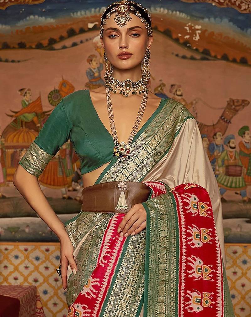 Beige ethnic motifs woven design patola saree