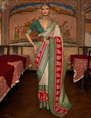 Beige ethnic motifs woven design patola saree 2
