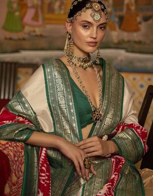 Beige ethnic motifs woven design patola saree 3