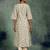 beige floral printed thread work panelled a-line kurta with palazzos