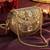 jharokha yellow & emerald green kundan embellished metal clutch