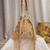 dewdrop fringe beige & multi floral embellished suede potli