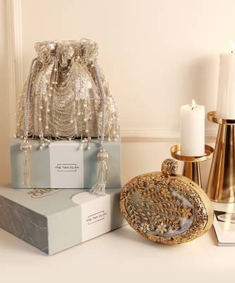 Gold mother of pearl clutch and silver potli bag combo 1