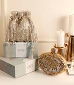Gold mother of pearl clutch and silver potli bag combo