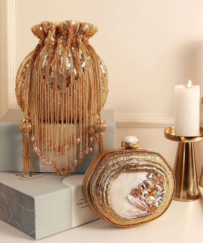Golden mother of pearl clutch and twinkle gold potli bag combo