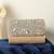 Grace beige flap bag and glitz silver clutch combo