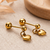 Cupid dangling hearts gold plated stud earring