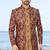 Baige sherwani with purple floral embroidery and matching trousers—perfect for weddings and celebrations.