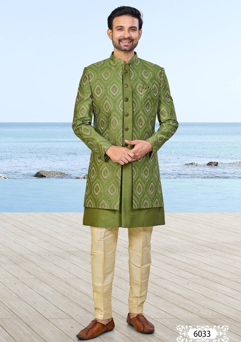 Olive green sherwani with gold detailing and cream trousers—ideal for celebrations.