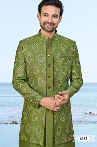 Olive green sherwani with gold detailing and cream trousers—ideal for celebrations.