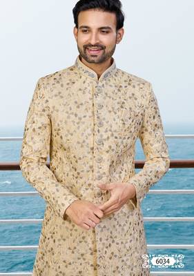 Fown colour sherwani with gold embroidery and matching trousers—perfect for weddings. 3