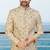 Fown colour sherwani with gold embroidery and matching trousers—perfect for weddings.