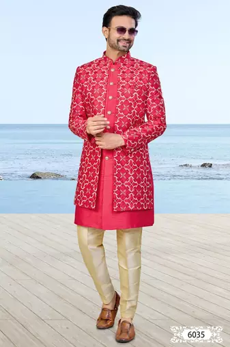 Red sherwani with gold detailing and cream trousers—perfect for weddings and celebrations.