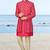 Red sherwani with gold detailing and cream trousers—perfect for weddings and celebrations.