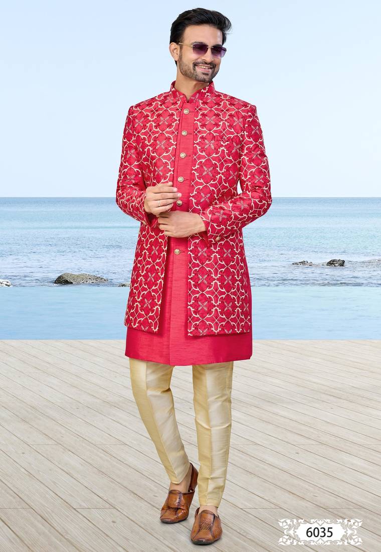 Red sherwani with gold detailing and cream trousers—perfect for weddings and celebrations.