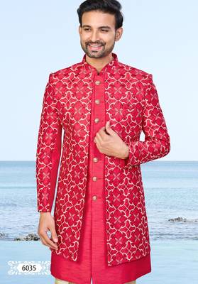 Red sherwani with gold detailing and cream trousers—perfect for weddings and celebrations. 3