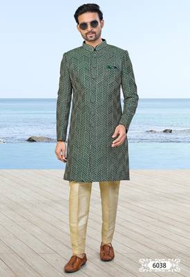 Green sherwani with geometric detailing, a pocket square, and gold-toned trousers—perfect for festive occasions. 1