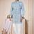 Light blue sherwani with white embroidery and mirror work, paired with white trousers—perfect for weddings.