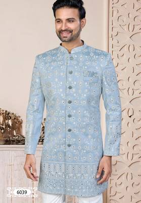 Light blue sherwani with white embroidery and mirror work, paired with white trousers—perfect for weddings. 3