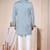 Light blue sherwani with white embroidery and mirror work, paired with white trousers—perfect for weddings.