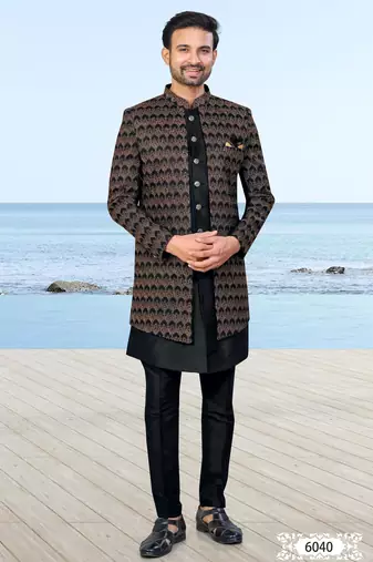 Black sherwani with copper-gold detailing and matching trousers—perfect for weddings and celebrations.