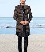 Black sherwani with copper-gold detailing and matching trousers—perfect for weddings and celebrations.