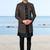 Black sherwani with copper-gold detailing and matching trousers—perfect for weddings and celebrations.