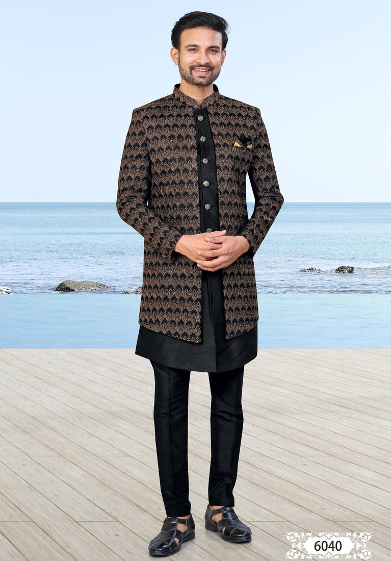 Black sherwani with copper-gold detailing and matching trousers—perfect for weddings and celebrations.
