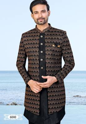 Black sherwani with copper-gold detailing and matching trousers—perfect for weddings and celebrations. 3