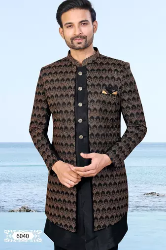 Black sherwani with copper-gold detailing and matching trousers—perfect for weddings and celebrations.