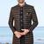Black sherwani with copper-gold detailing and matching trousers—perfect for weddings and celebrations.