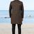 Black sherwani with copper-gold detailing and matching trousers—perfect for weddings and celebrations.