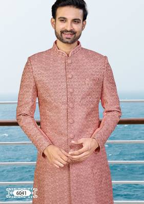 Peach sherwani with woven detailing and gold-toned trousers—perfect for weddings and celebrations. 3