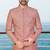 Peach sherwani with woven detailing and gold-toned trousers—perfect for weddings and celebrations.