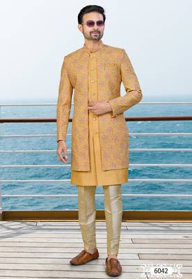 Mustard sherwani with pink and gold floral embroidery—perfect for festive weddings. 1
