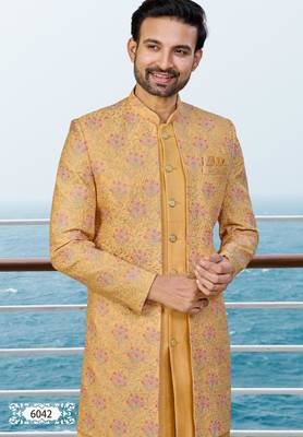 Mustard sherwani with pink and gold floral embroidery—perfect for festive weddings. 3