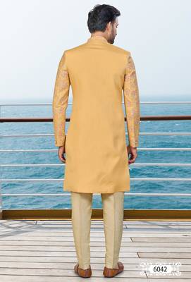 Mustard sherwani with pink and gold floral embroidery—perfect for festive weddings. 4